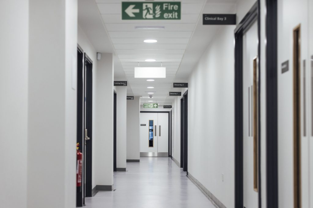 Fire doors in a corridor. Hotel doors must have a fire-resistance rating, signifying their ability to endure fire for a minimum amount of time when properly installed.