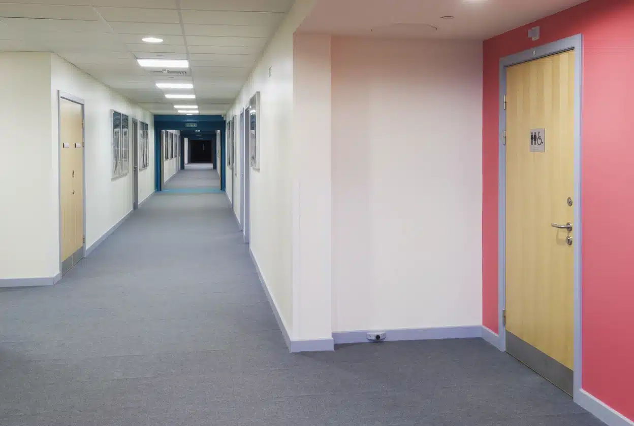 Fire door in healthcare corridor.